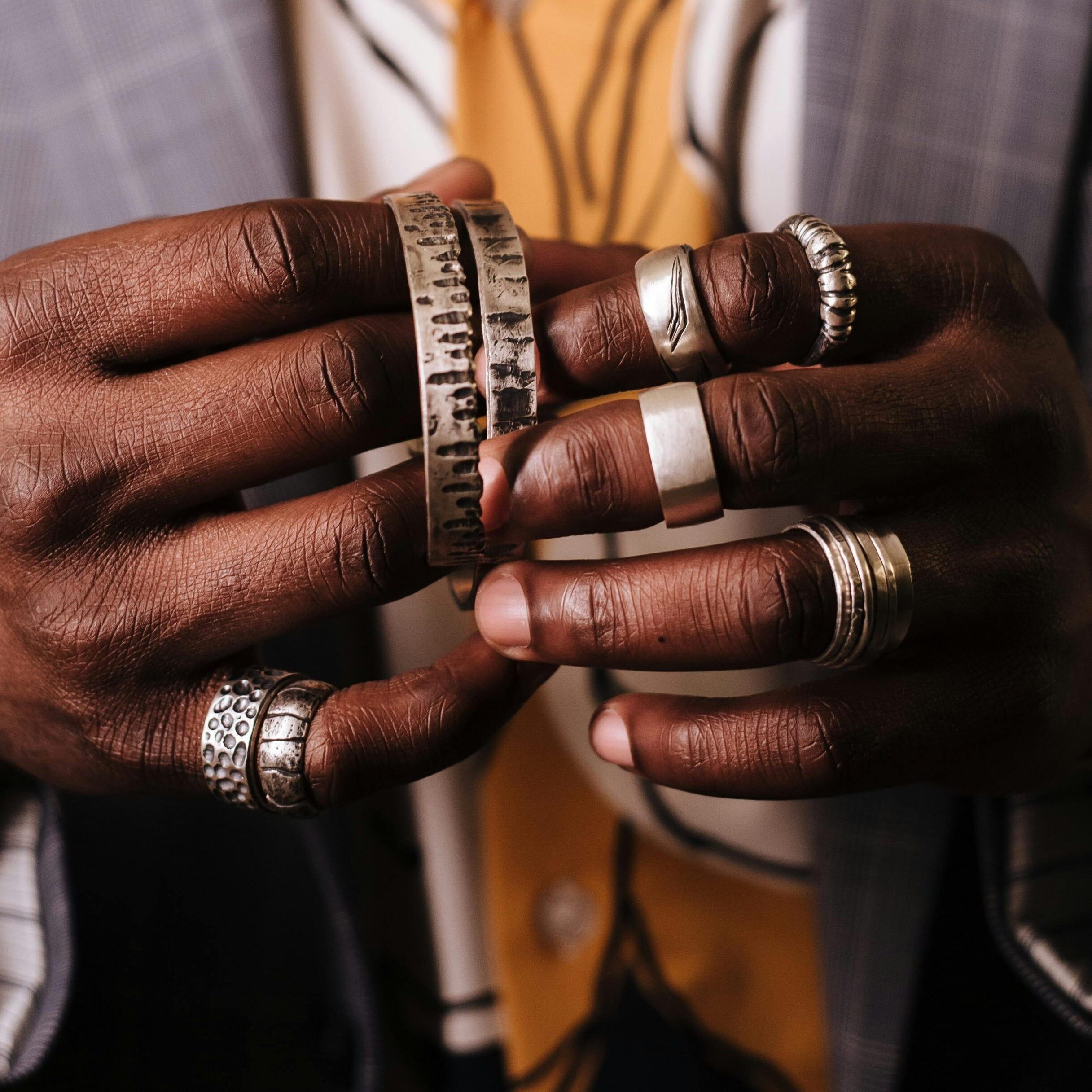 chunky rings worn by a man
